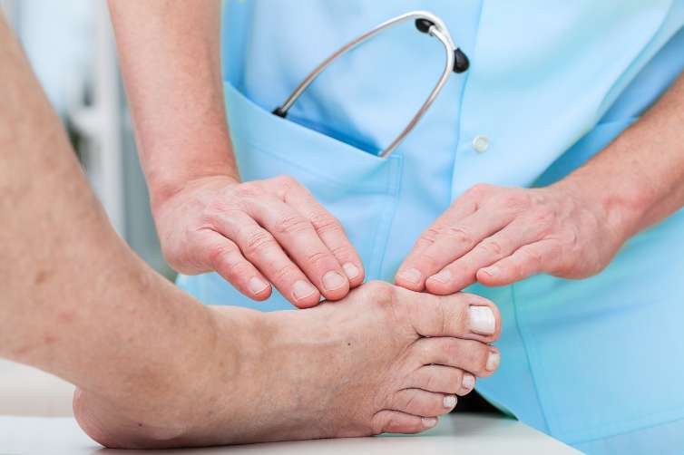 doctor touching feet